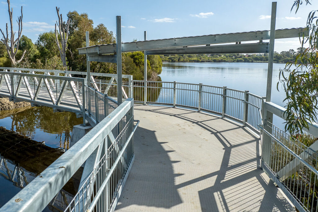 pedestrian bridge and viewing platform overlooking a waterway