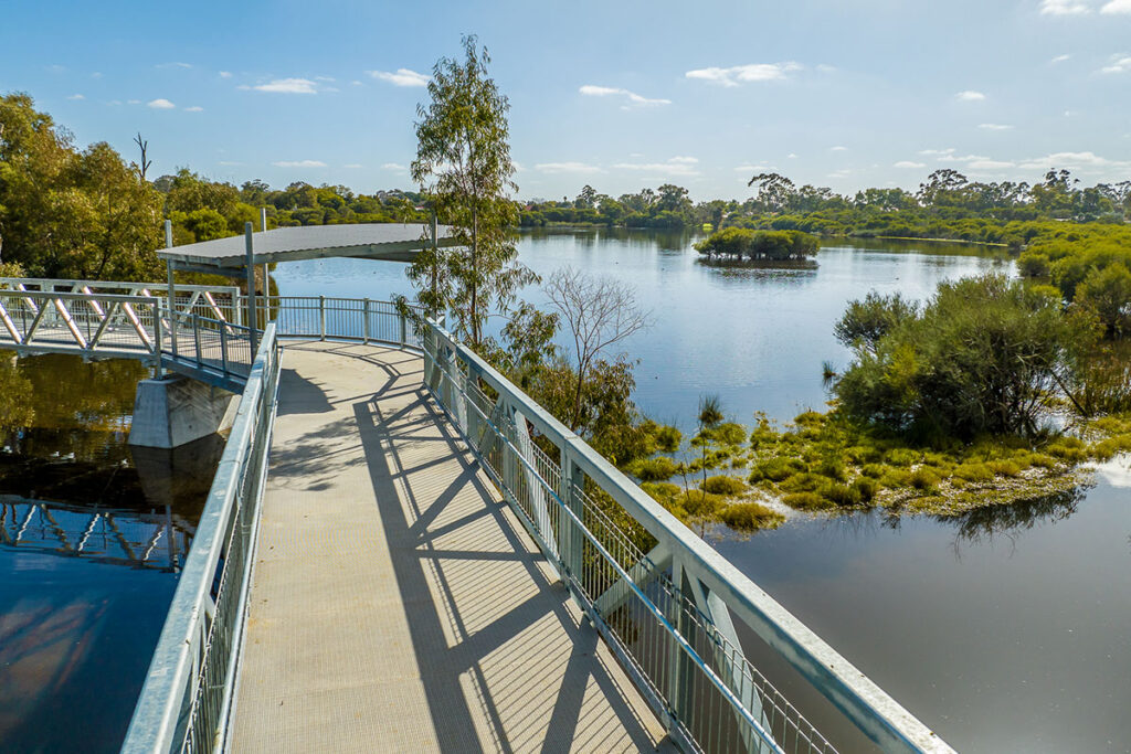 pedestrian bridge and viewing platform overlooking a waterway